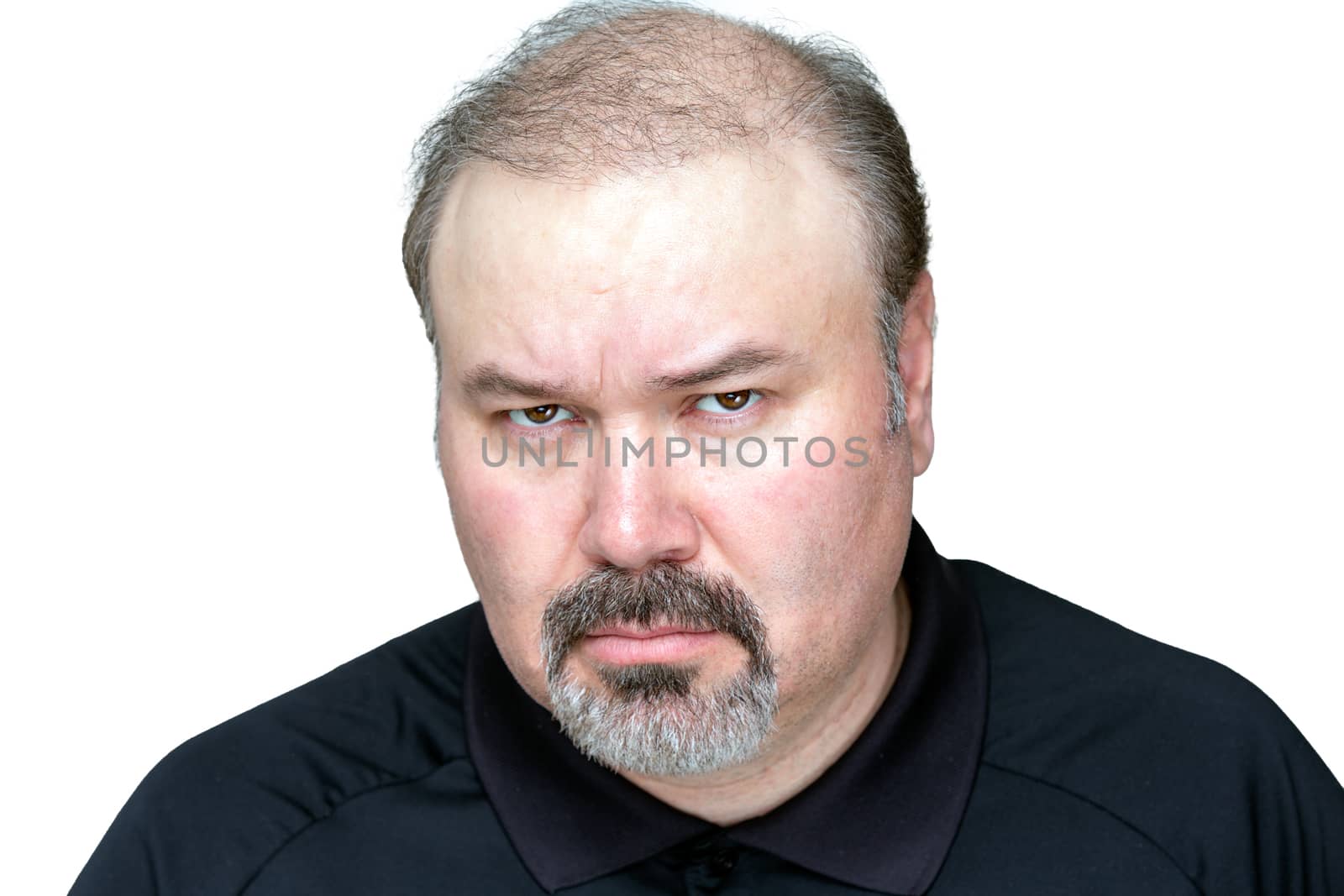 Angry man isolated on white, looking meanly.