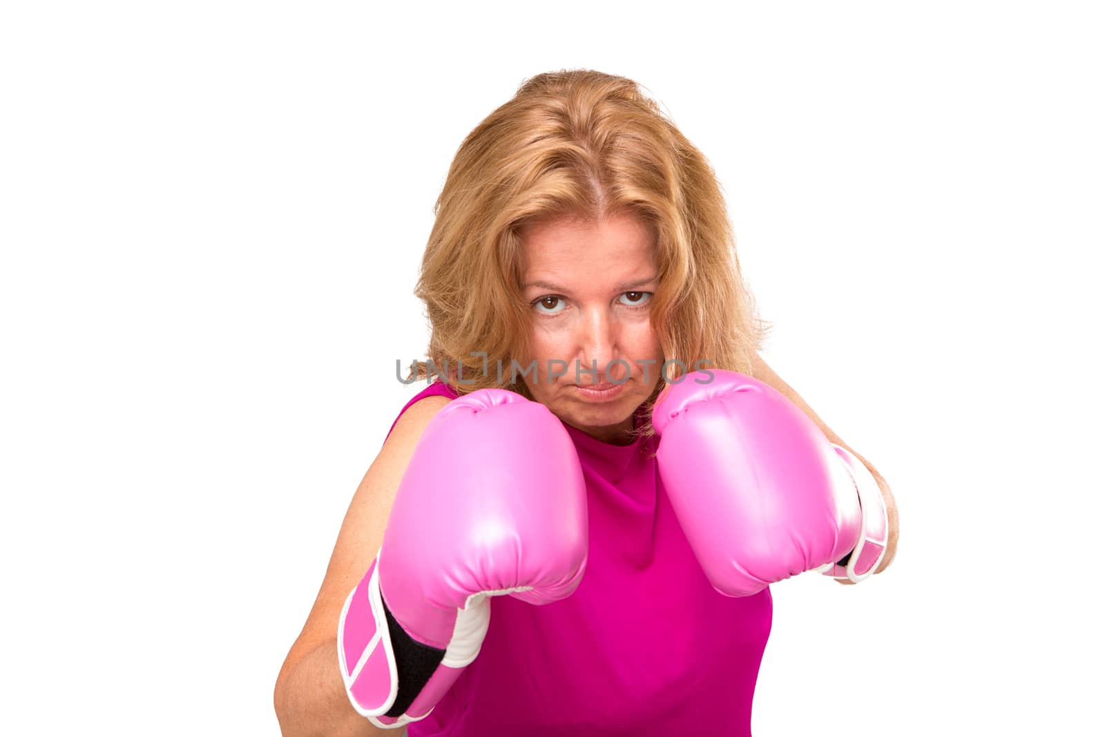 A blonde woman wearing a pink blouse and a pink gloves.