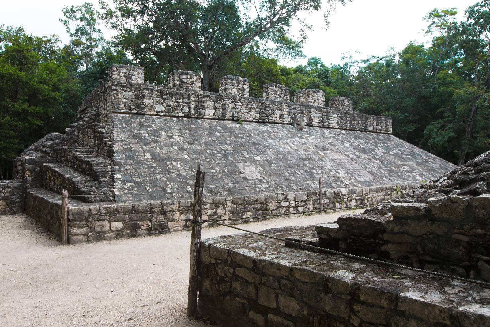 Deadly game, Mayan Ball game at ballcourt, ancient stone goal attached to the pyramid structure.