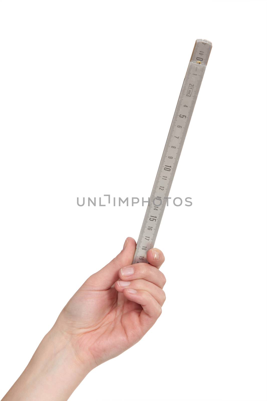 Female hand holding a ruler by phovoir