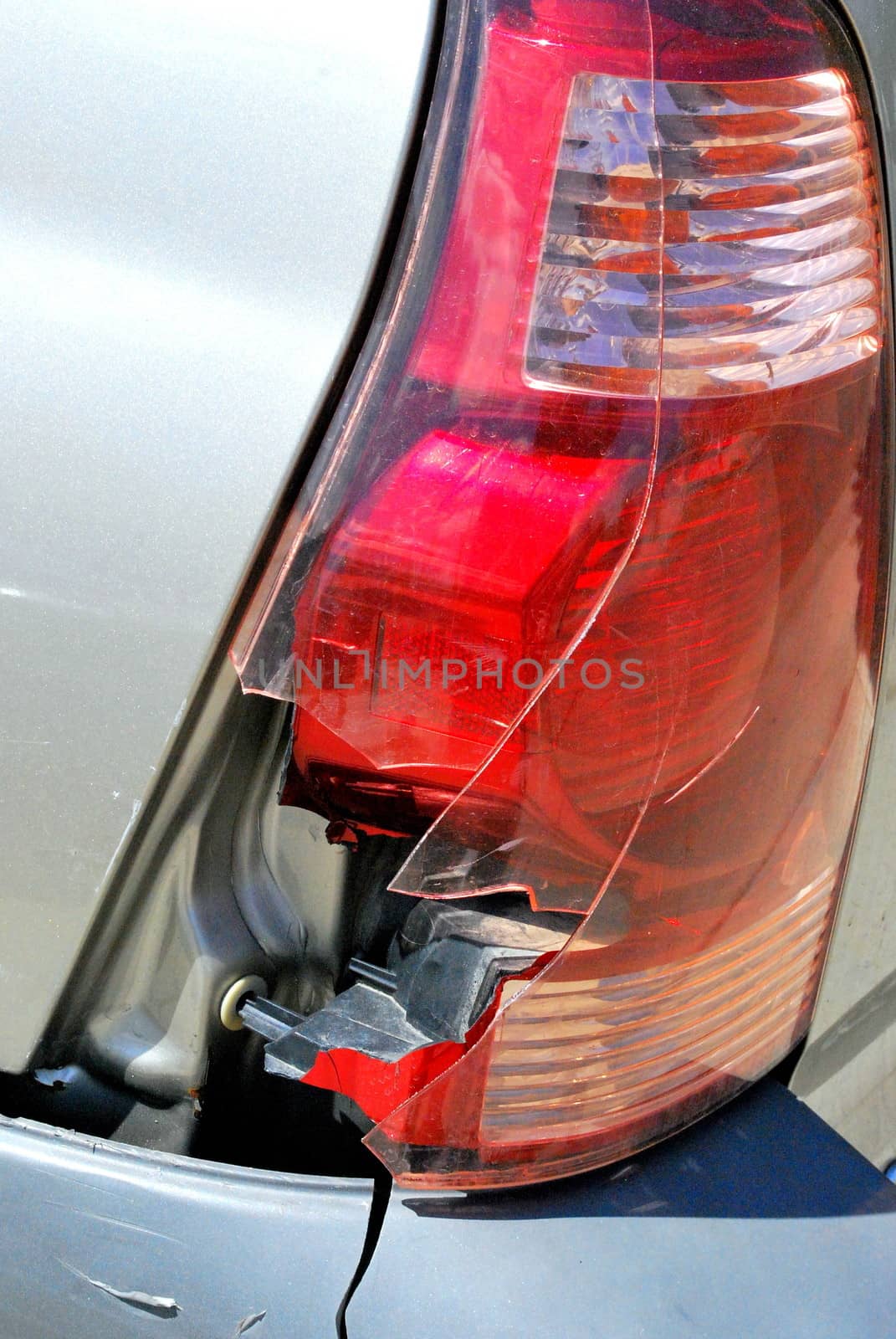 Broken tail light on a car from an accident.