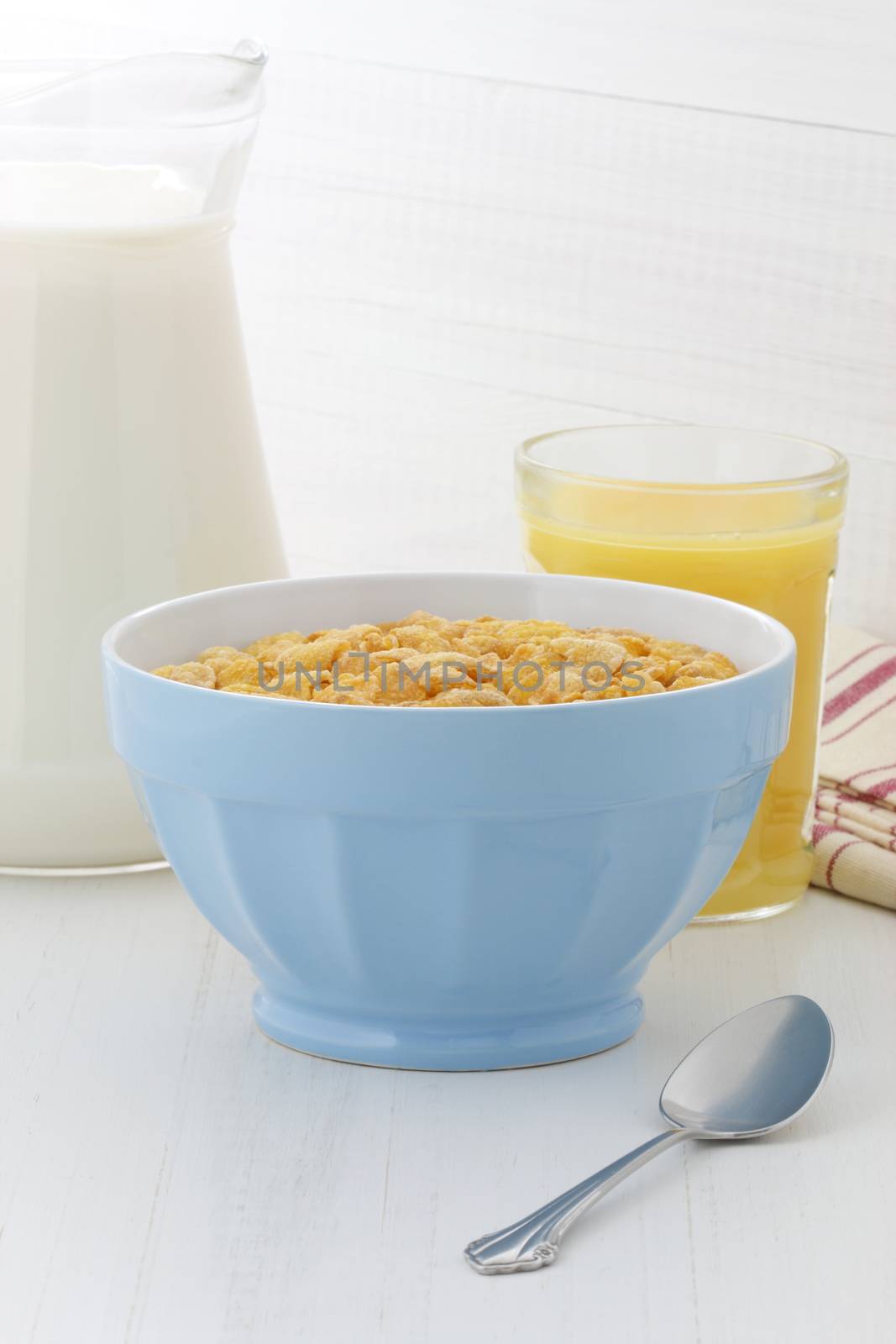 delicious and healthy corn flakes, with fresh milk and orange juice