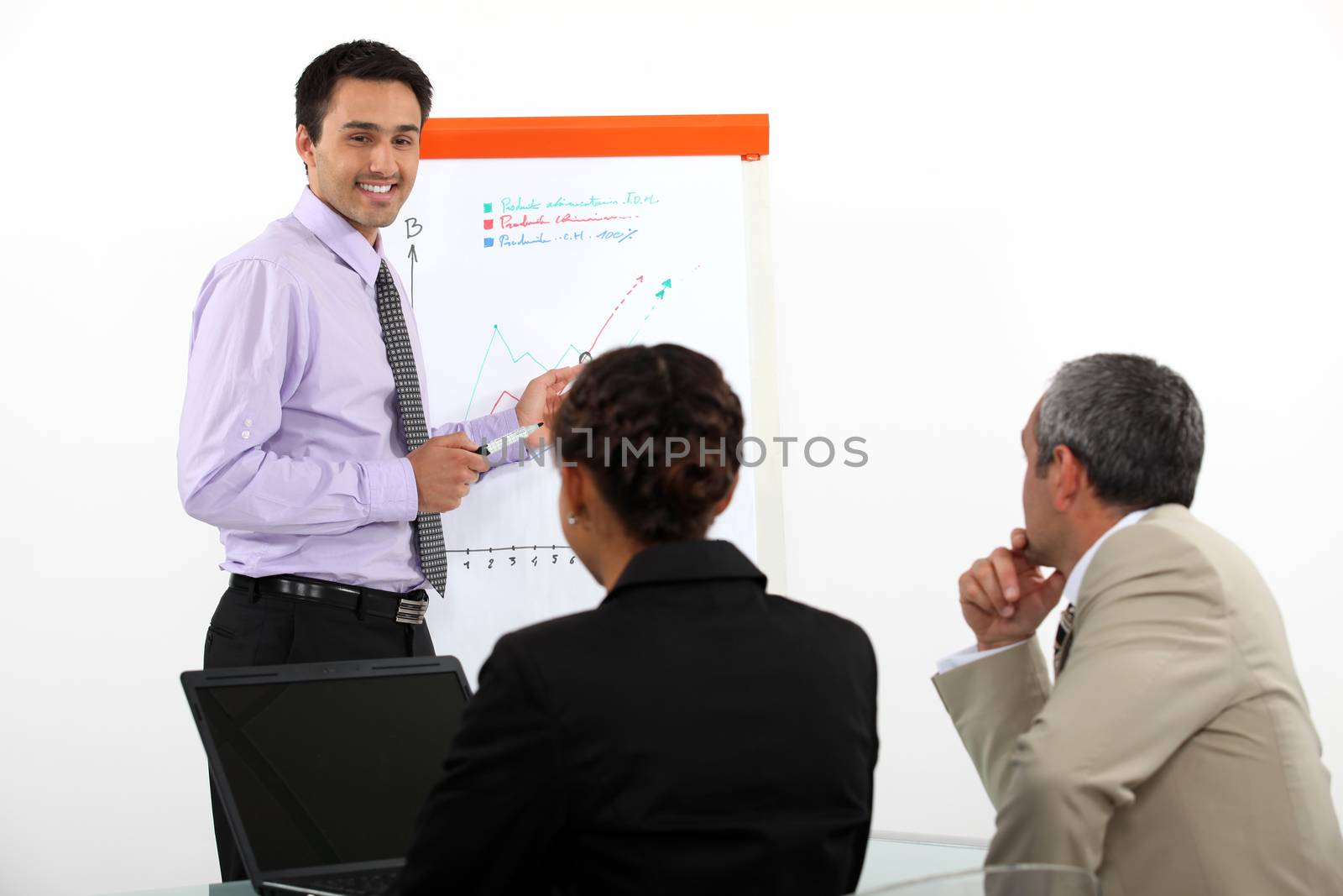 Man stood giving a presentation by phovoir