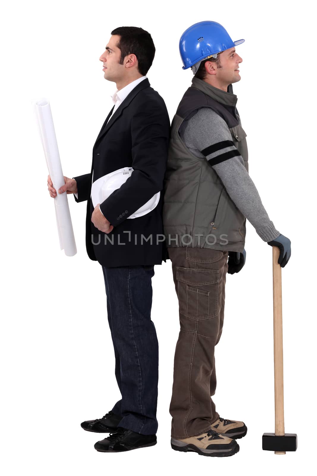 Architect and construction worker standing back to back