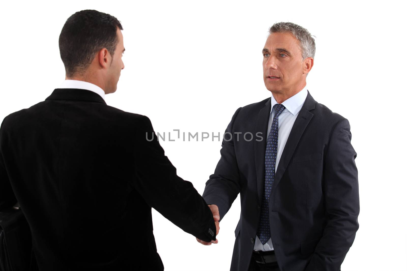 A business handshake by phovoir