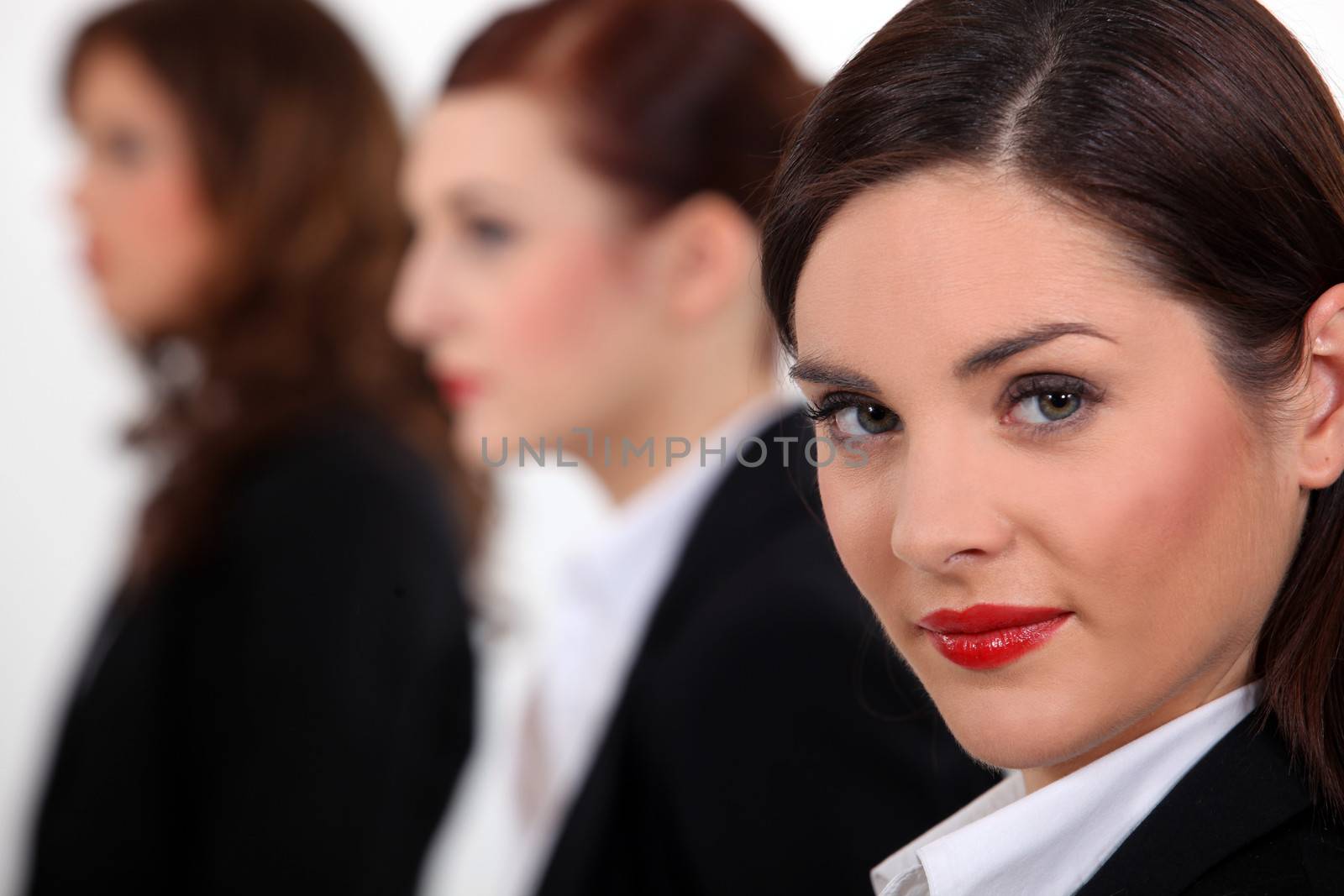 Businesswomen at a meeting together by phovoir