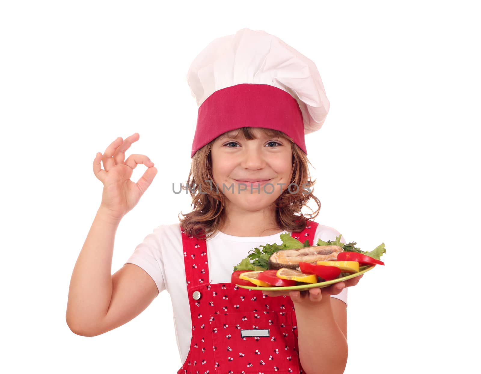happy little girl with salmon seafood and ok hand sign by goce