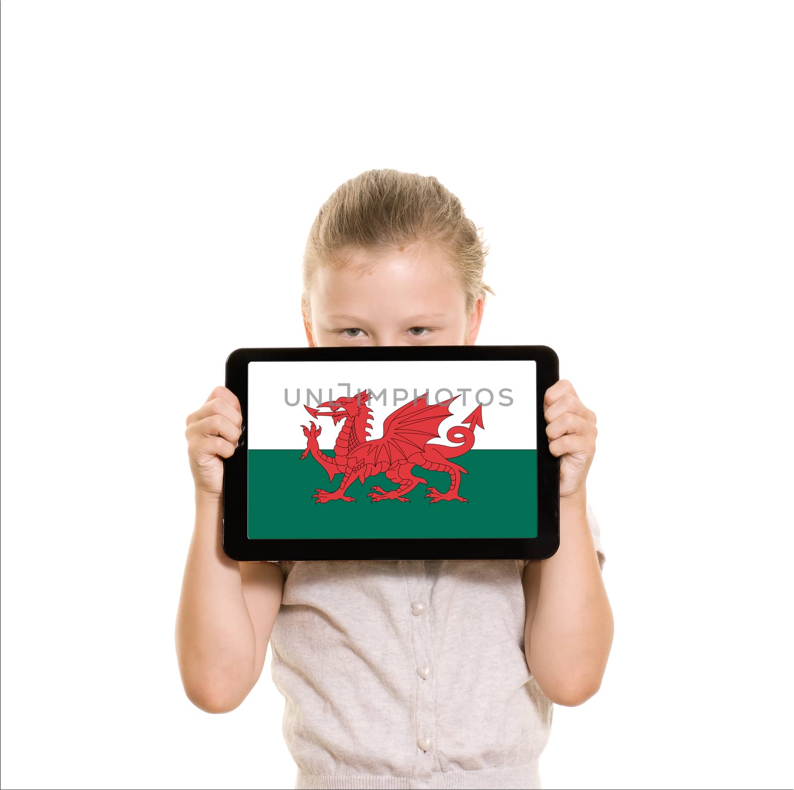 Girl holding tablet pc displaying flag of Wales