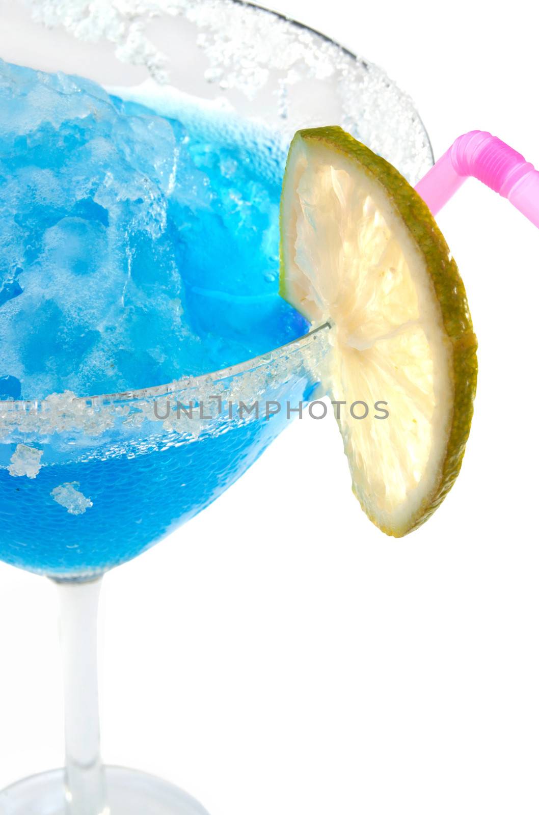 Frozen crushed ice blue cocktail with slice of lime
