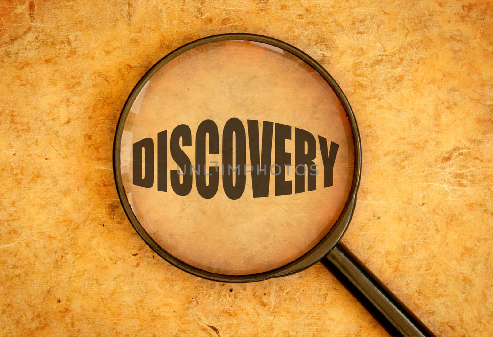 Magnifying glass focused on the word discovery