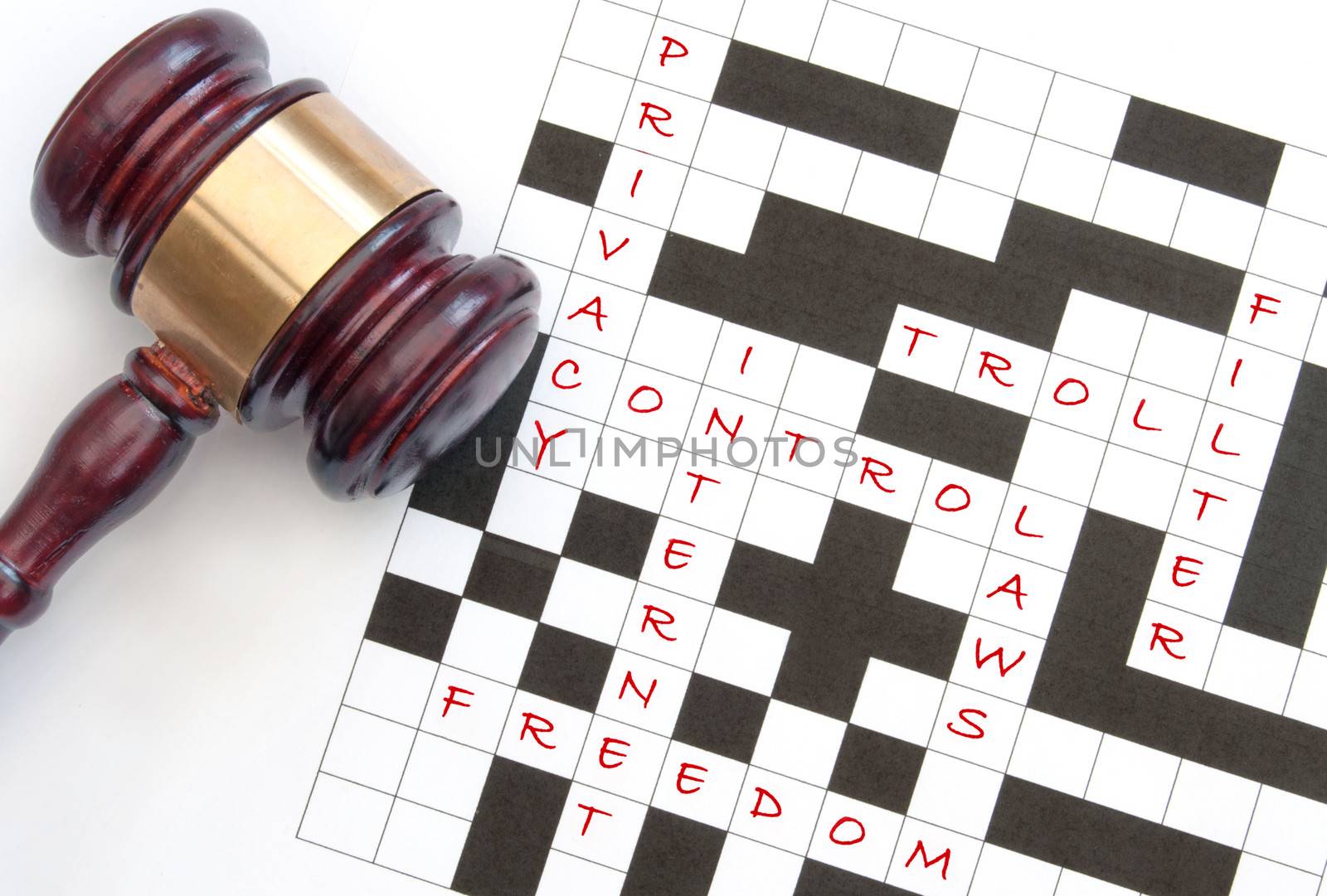 Crossword with issues relating to the internet with a gavel on one side 