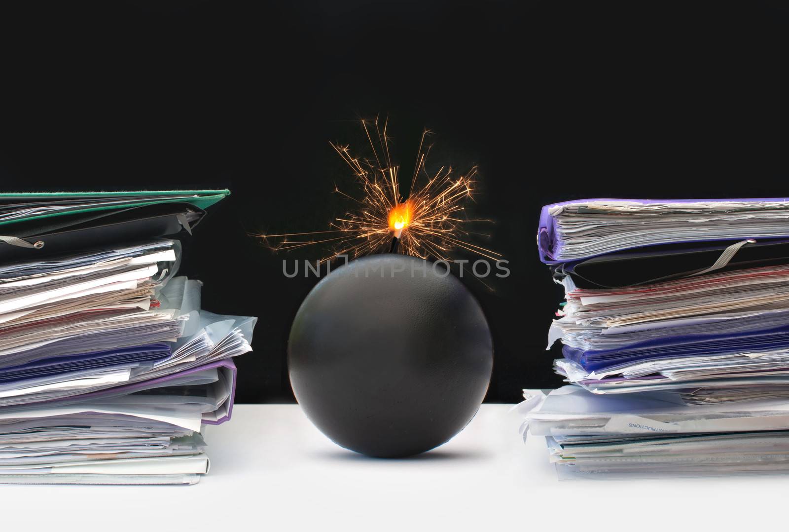 Exploding bomb inbetween two stacks of paperwork
