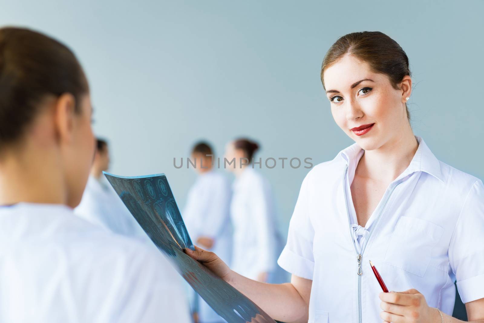 Doctor talking with a colleague, collaboration in medicine