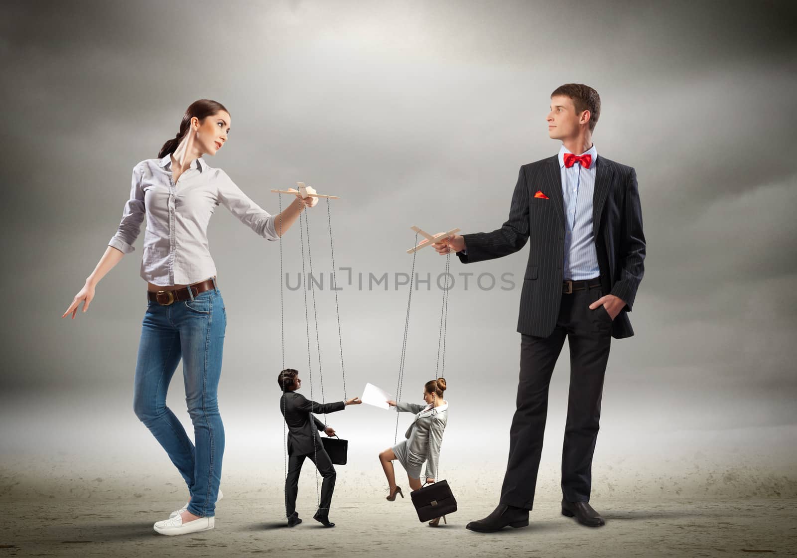 Image of man and woman with marionette puppets