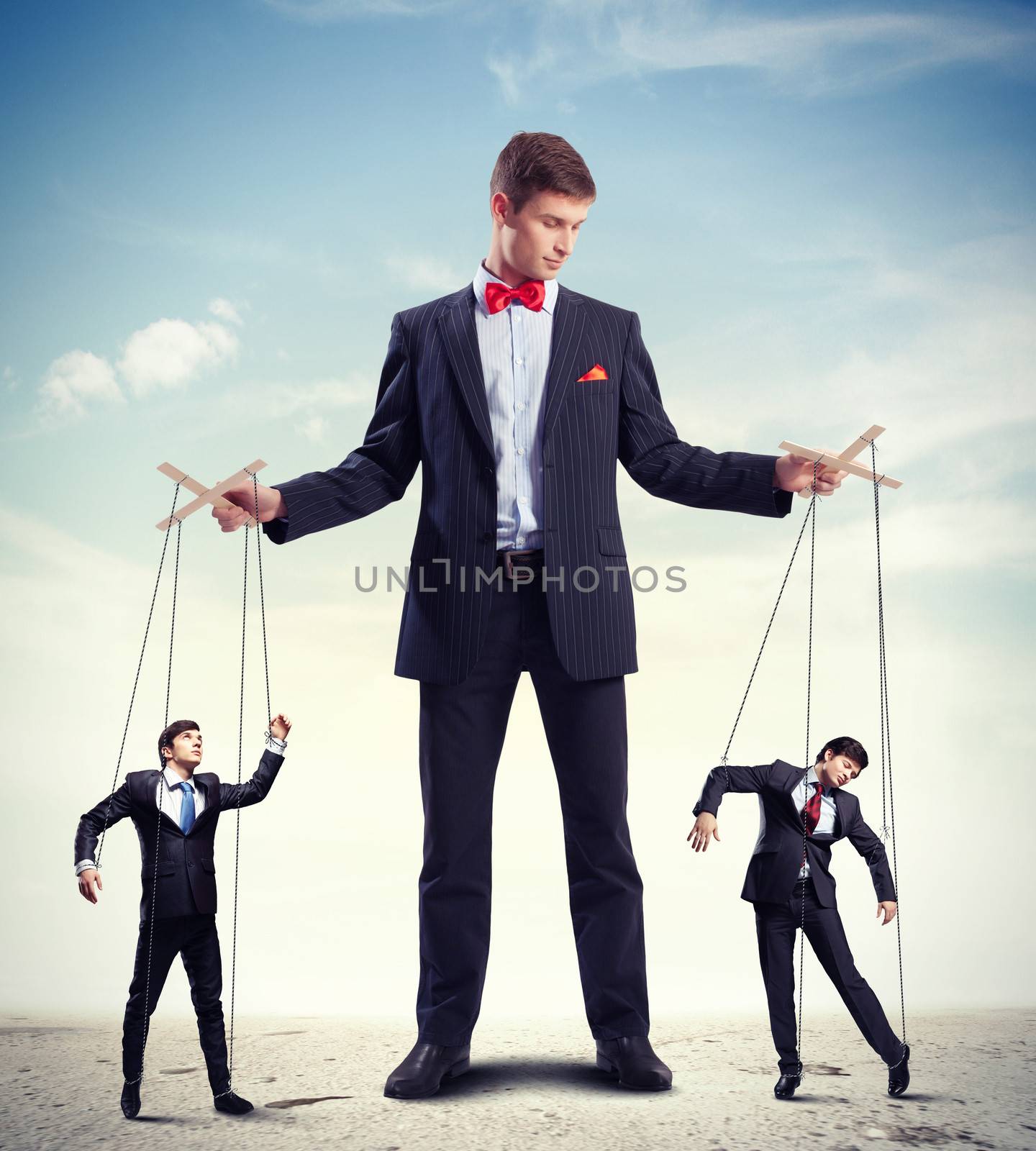 Image of young businessman puppeteer. Leadership concept