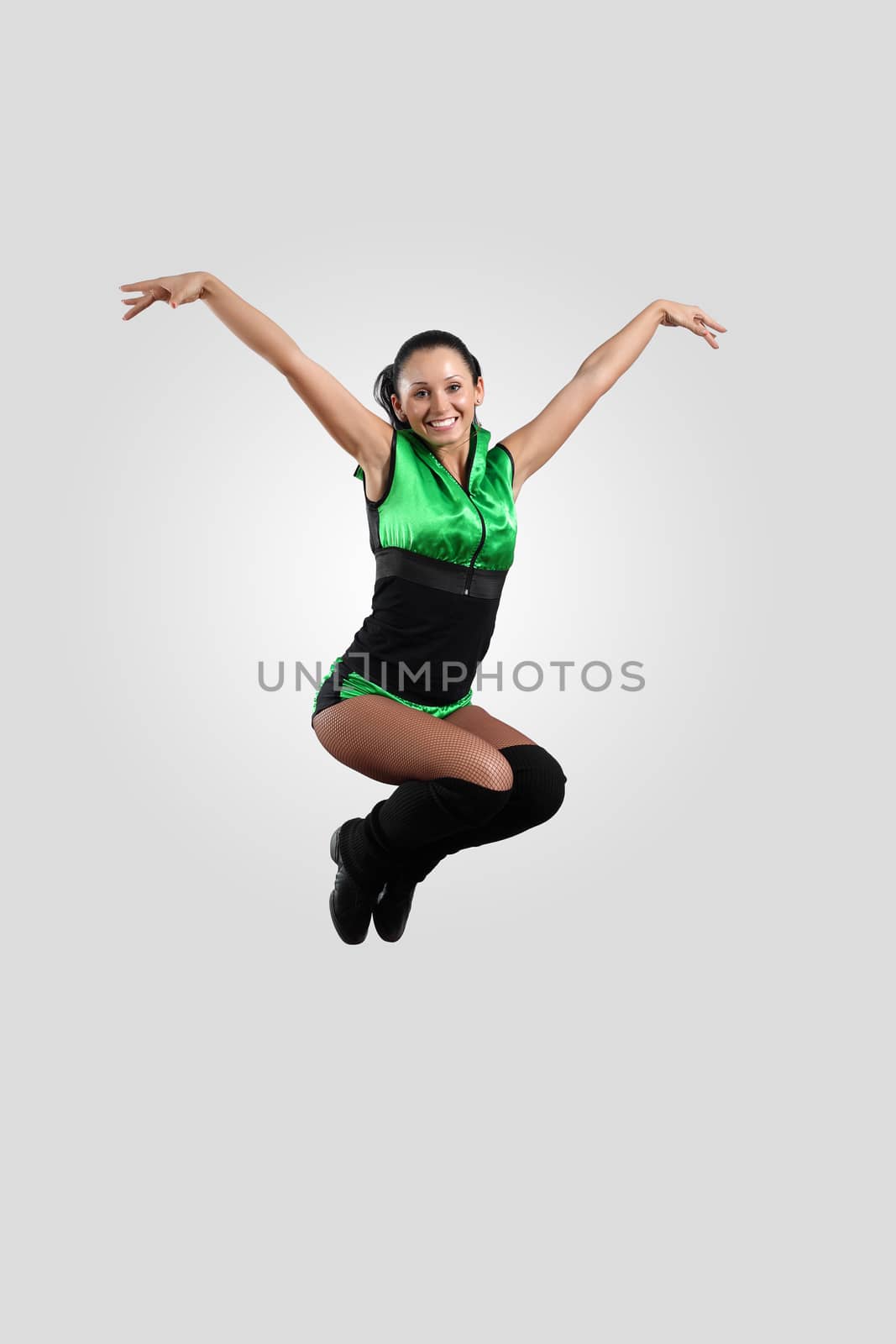Young female dancer against white background by sergey_nivens