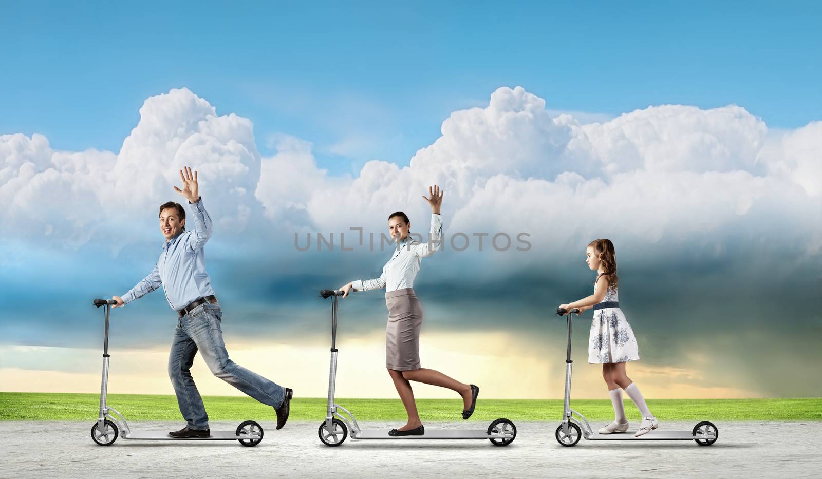 Image of happy young family riding scooter