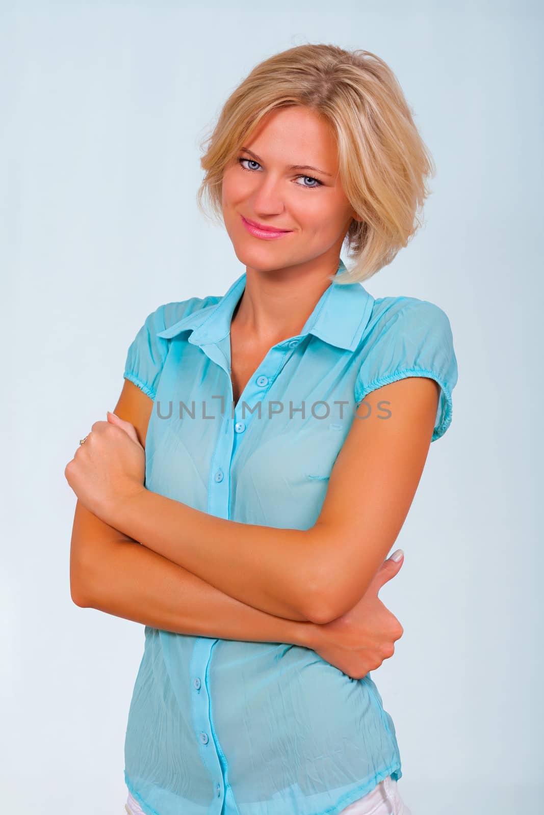 a beautifule girl wearing a light blue blouse