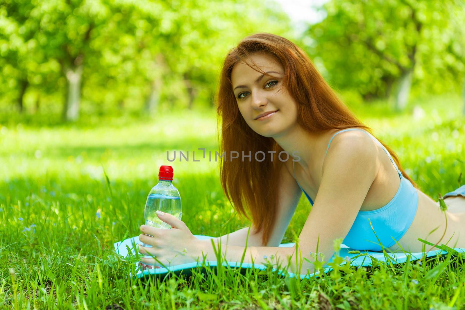 a beautyful brunette on grass