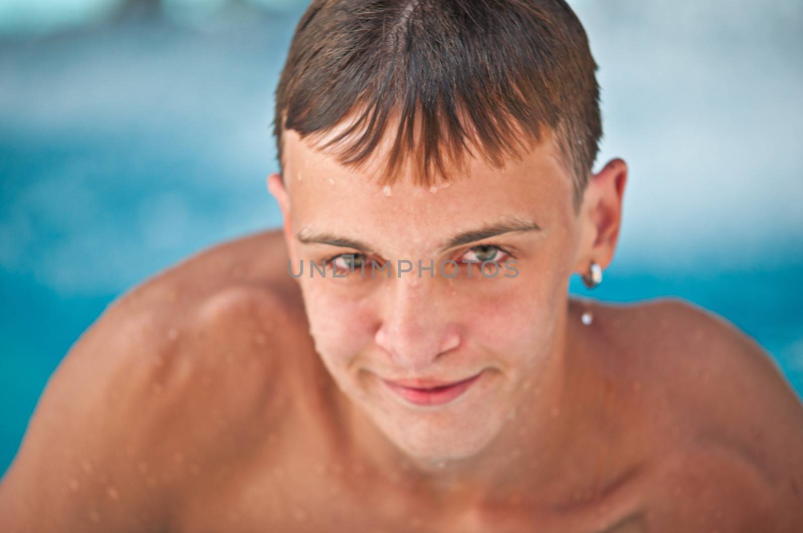 Portrait of a teen close-up in a swimming pool .