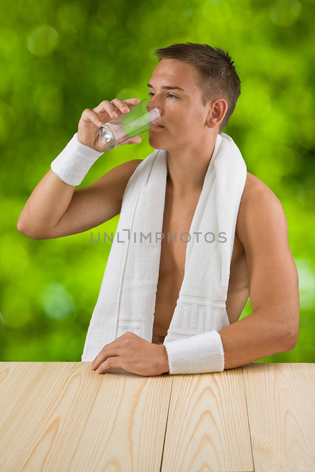 young boy drinks water