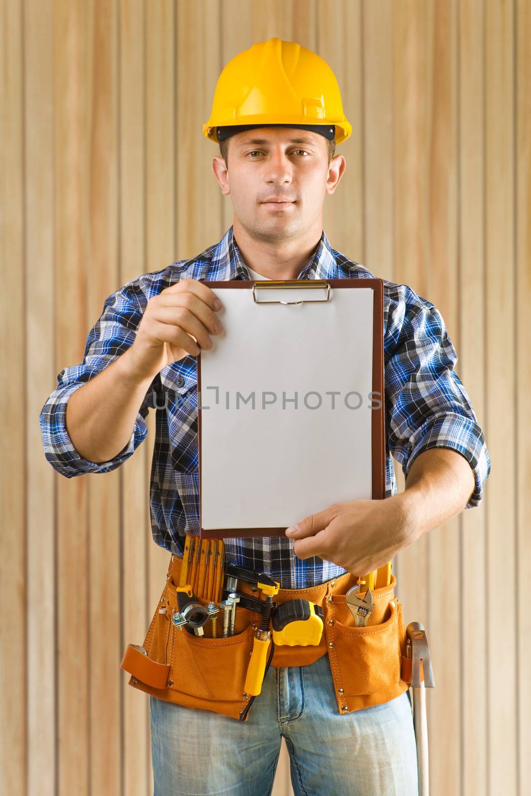 worker holding paperclip by mihalec