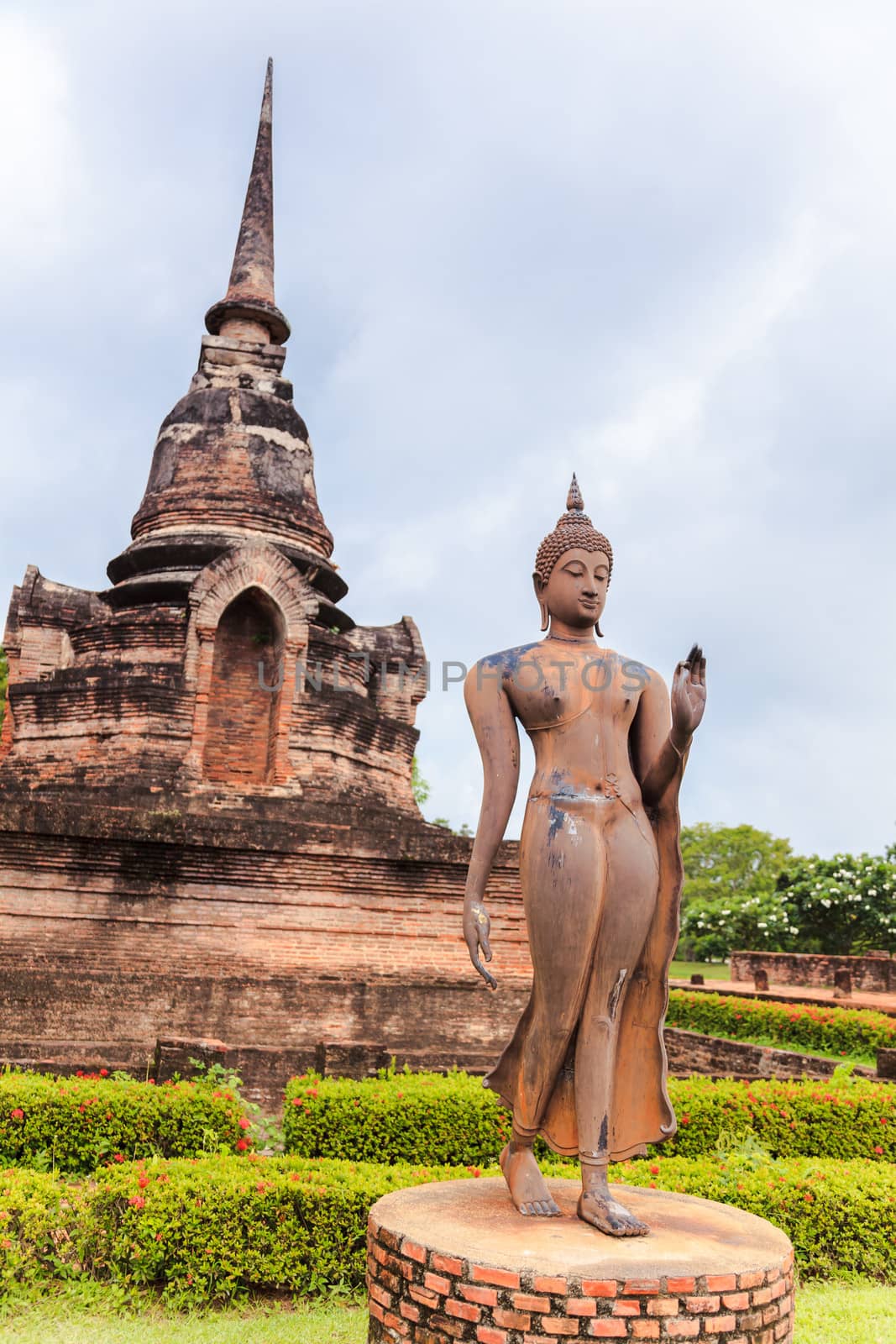 Standing buddha statue in sukhothai historical park, sukhothai province, thailand