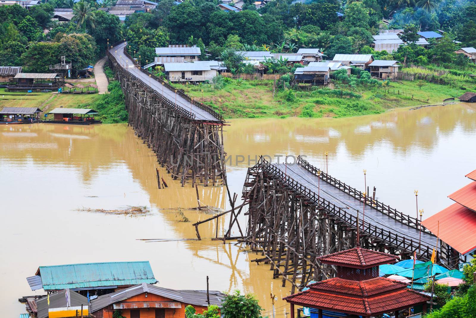 Famous wooden mon bridge in kanchanaburi collapsed during the flash floods