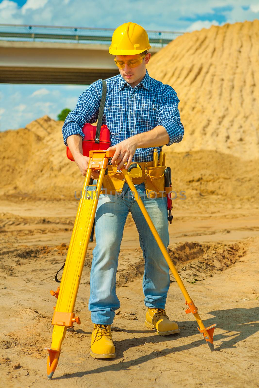 a young contractor with theodolite