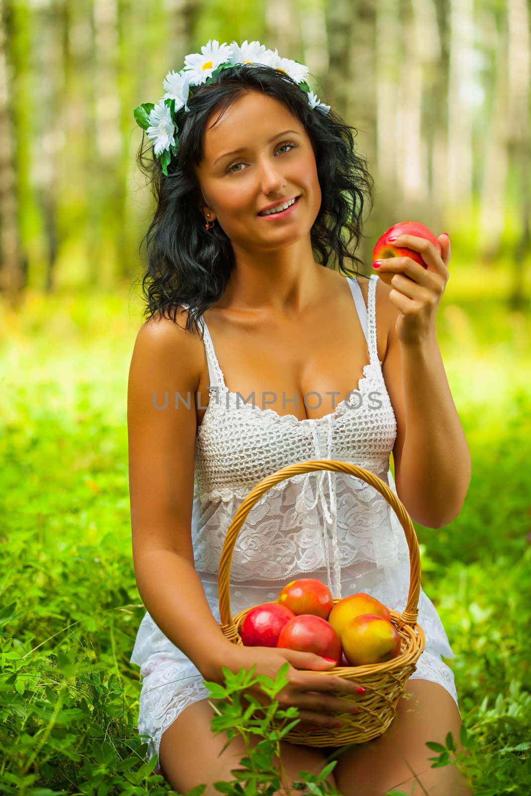 a young female holding apple