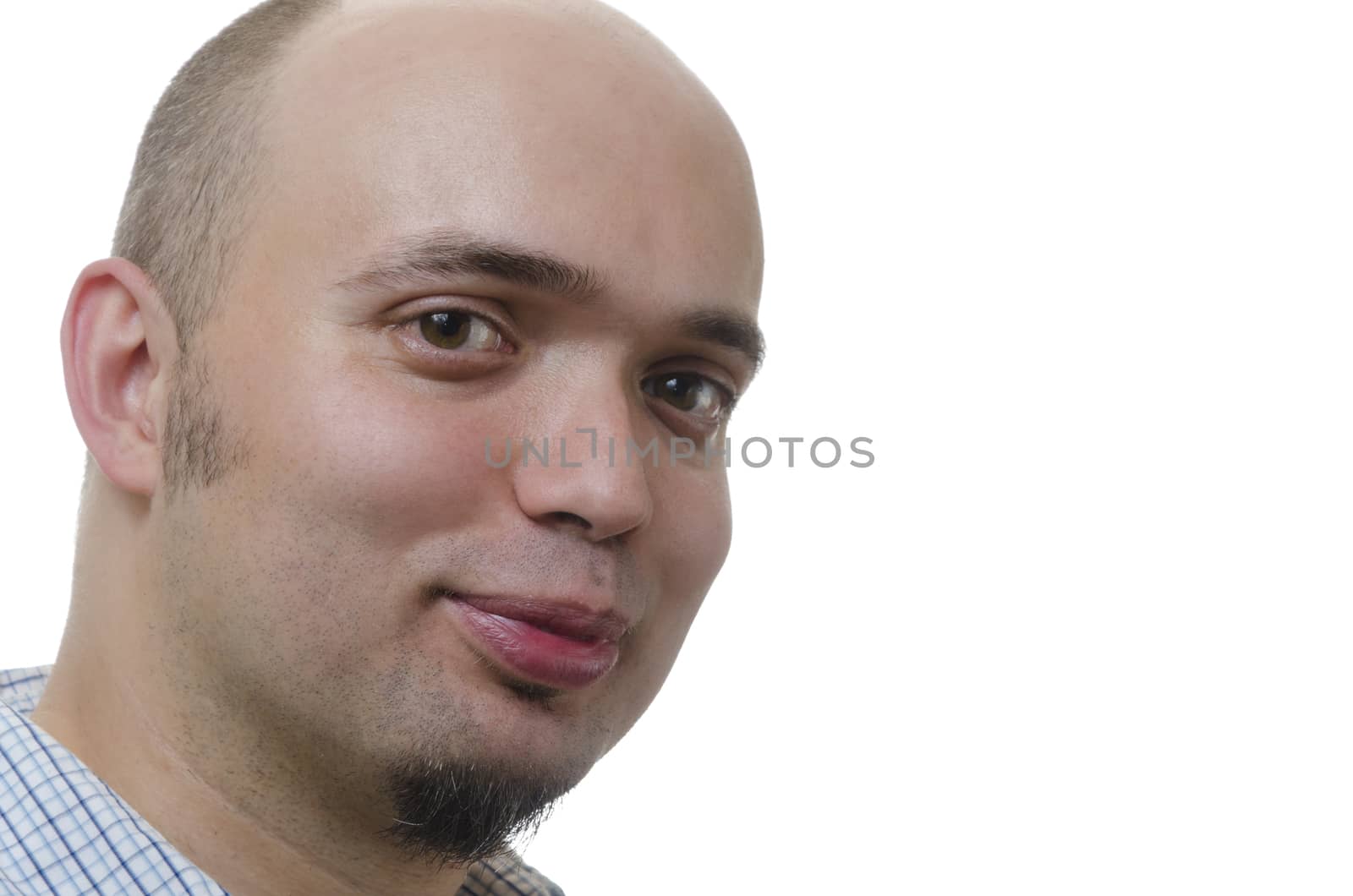 portrait of a young man slightly bald smiling on white background