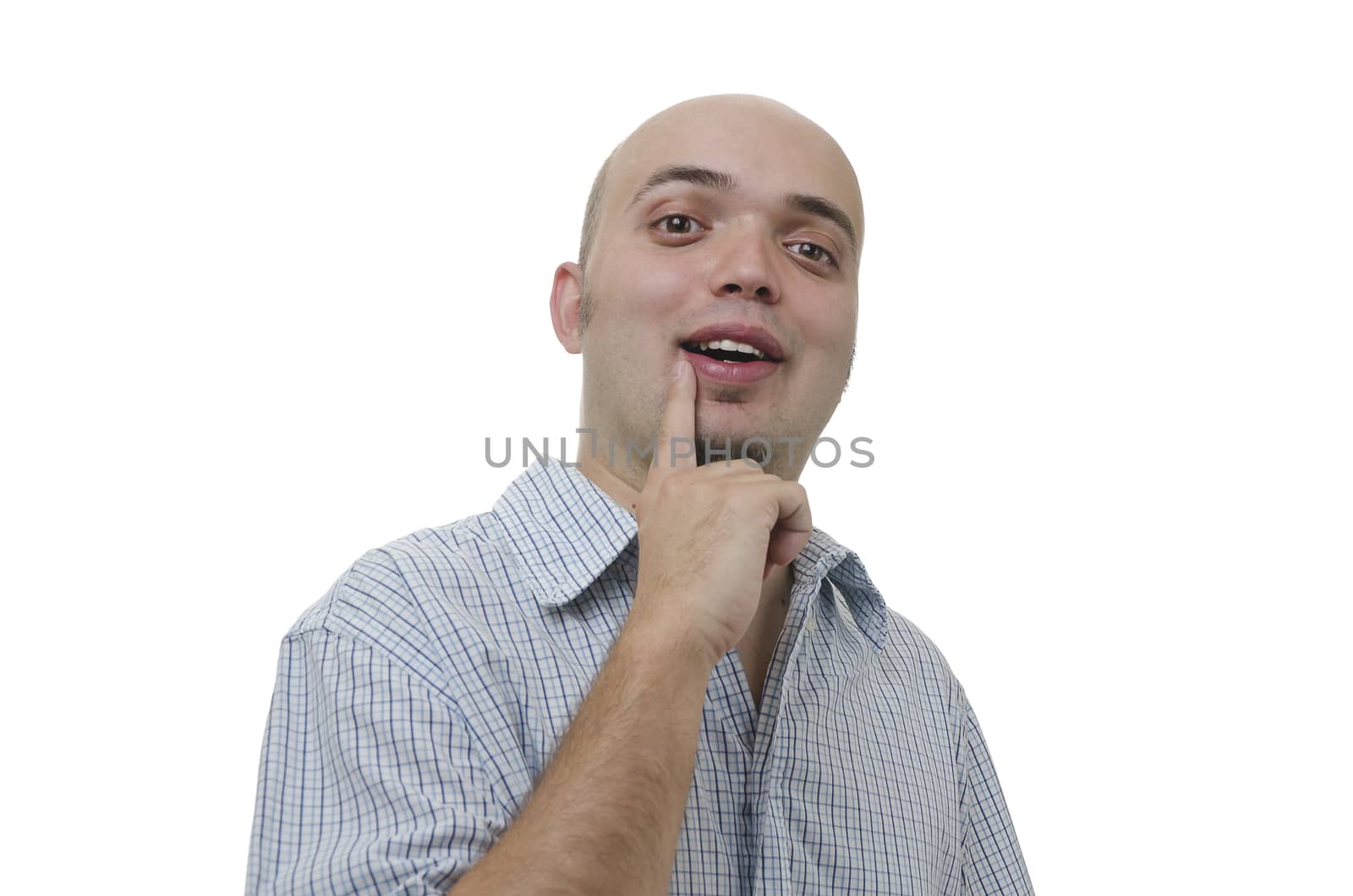 young man with an idea and finger on his lip on white background