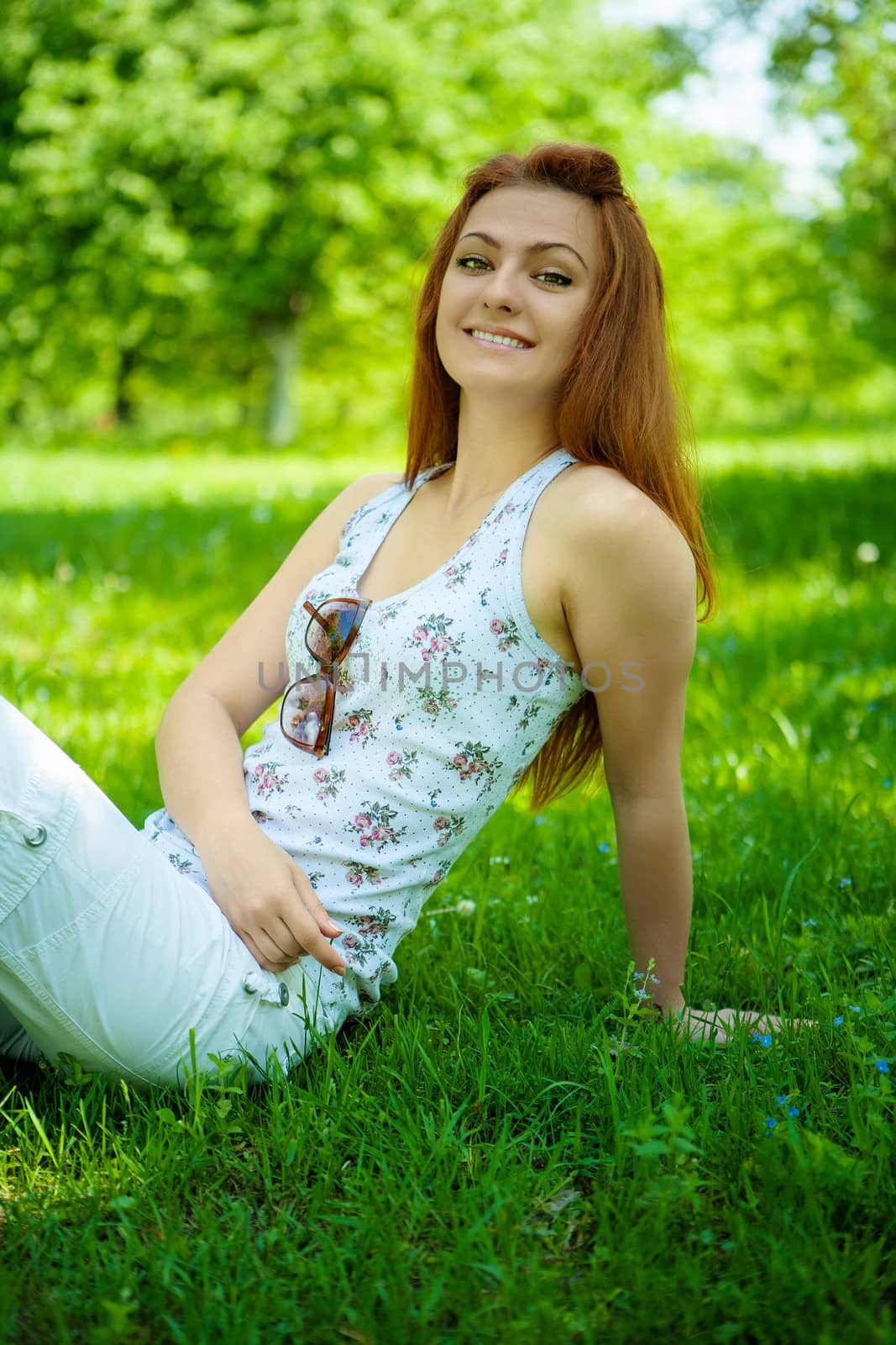 brunette on green grass by mihalec