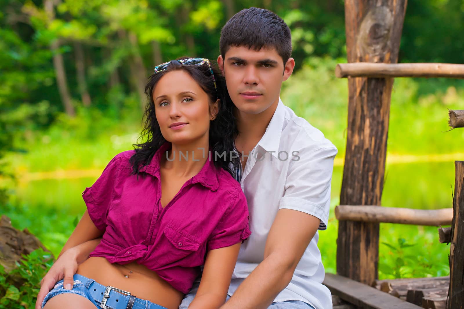 couple sitting and looking at camera
