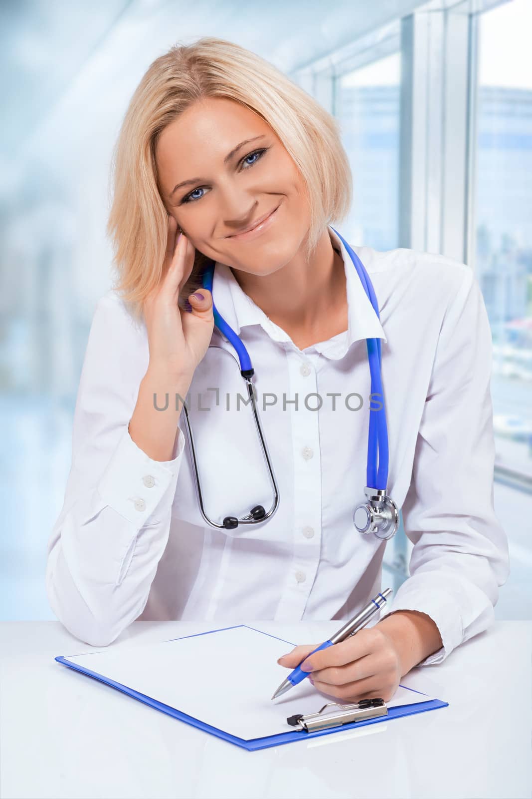 fryendly female doctor at hte table