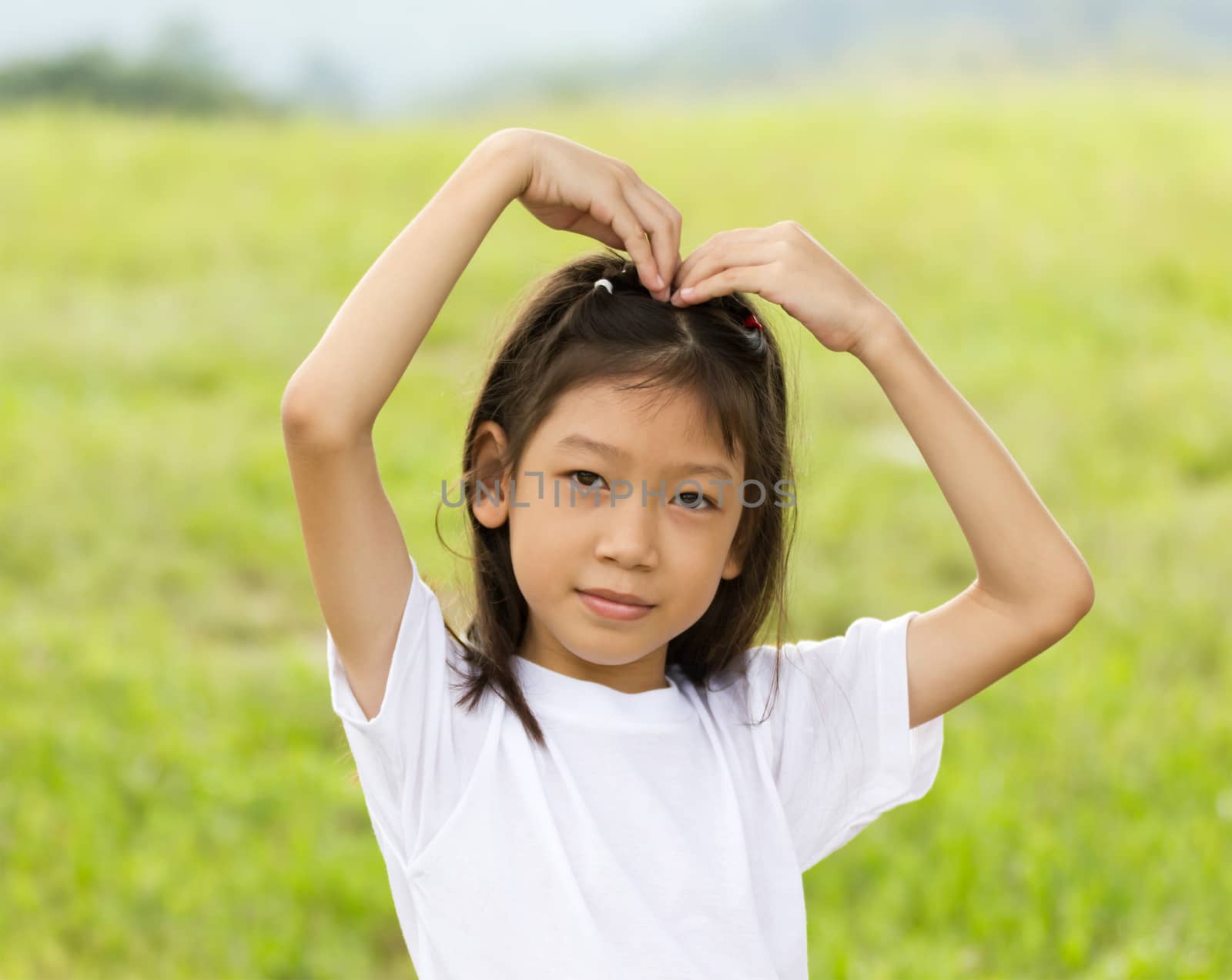 Outdoors portrait of beautiful Asian young girl