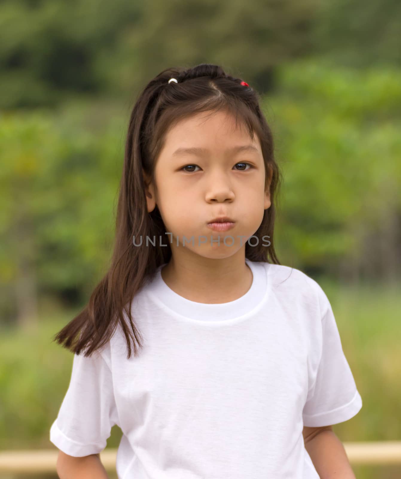 Outdoors portrait of beautiful Asian young girl