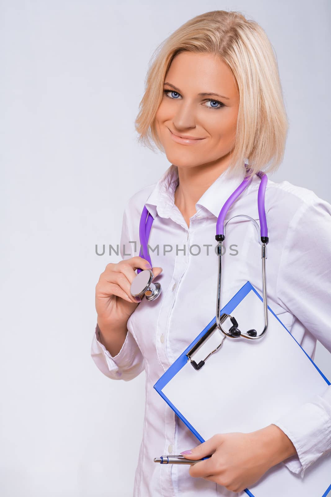 smiling medical woman doctor by mihalec