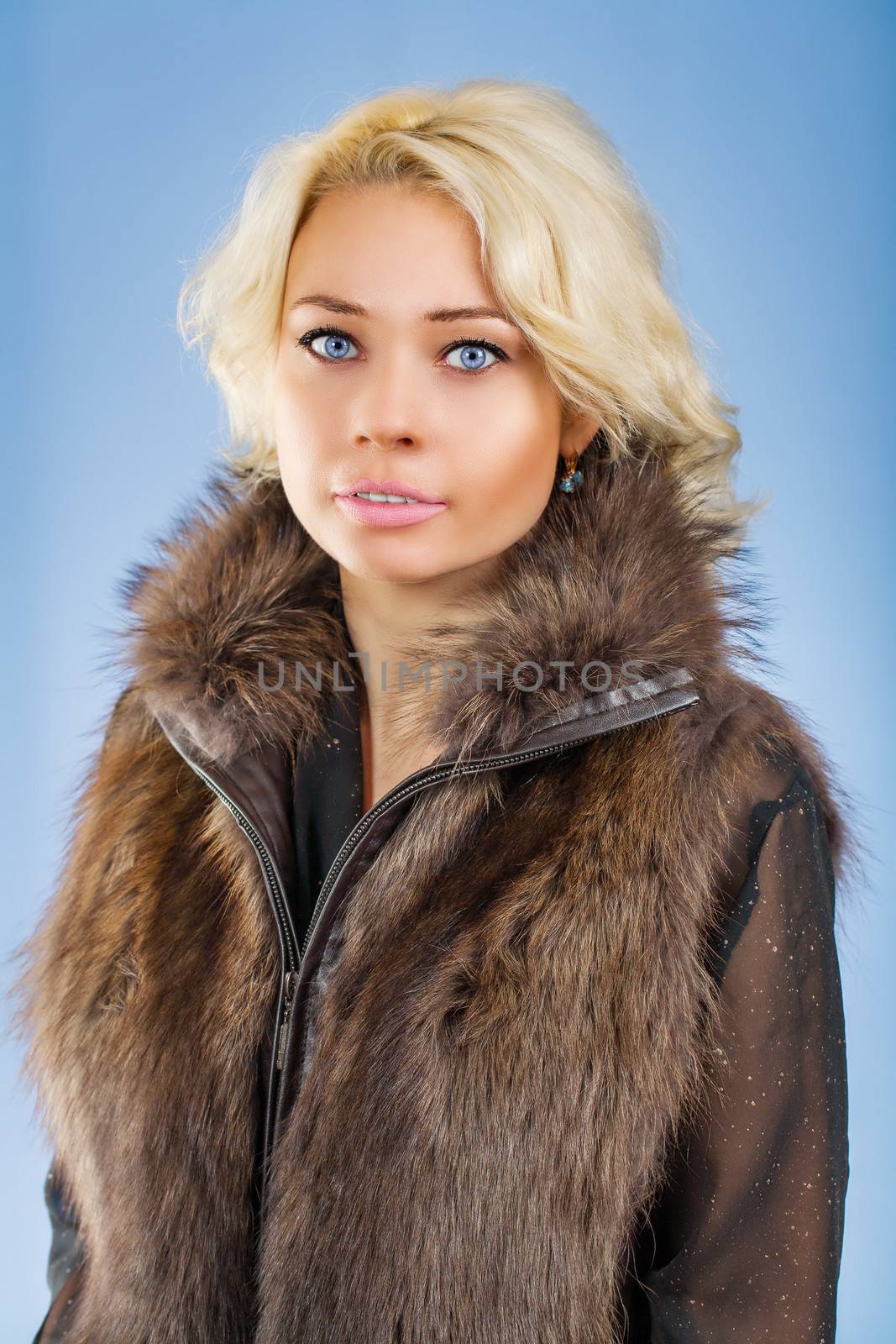 a beautyful blonde in fur coat