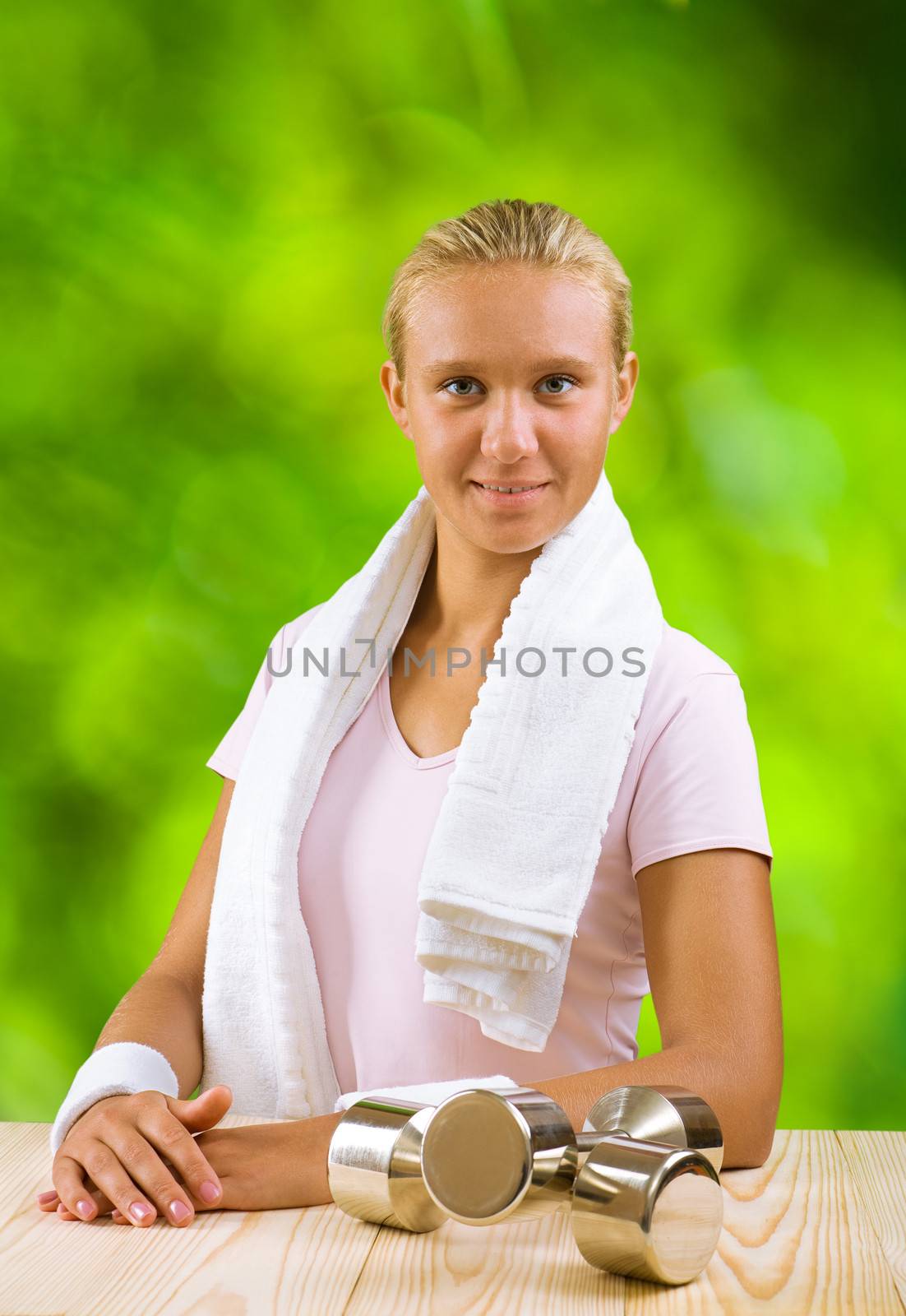 a girl at table with dumbbell by mihalec