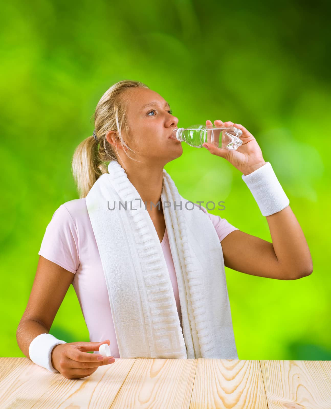 a girl drinking water from bottle by mihalec