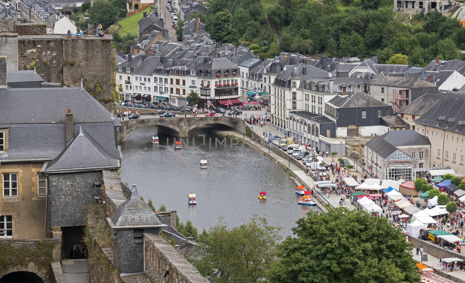 view on the belgium city bouillon with the market and boats on the river