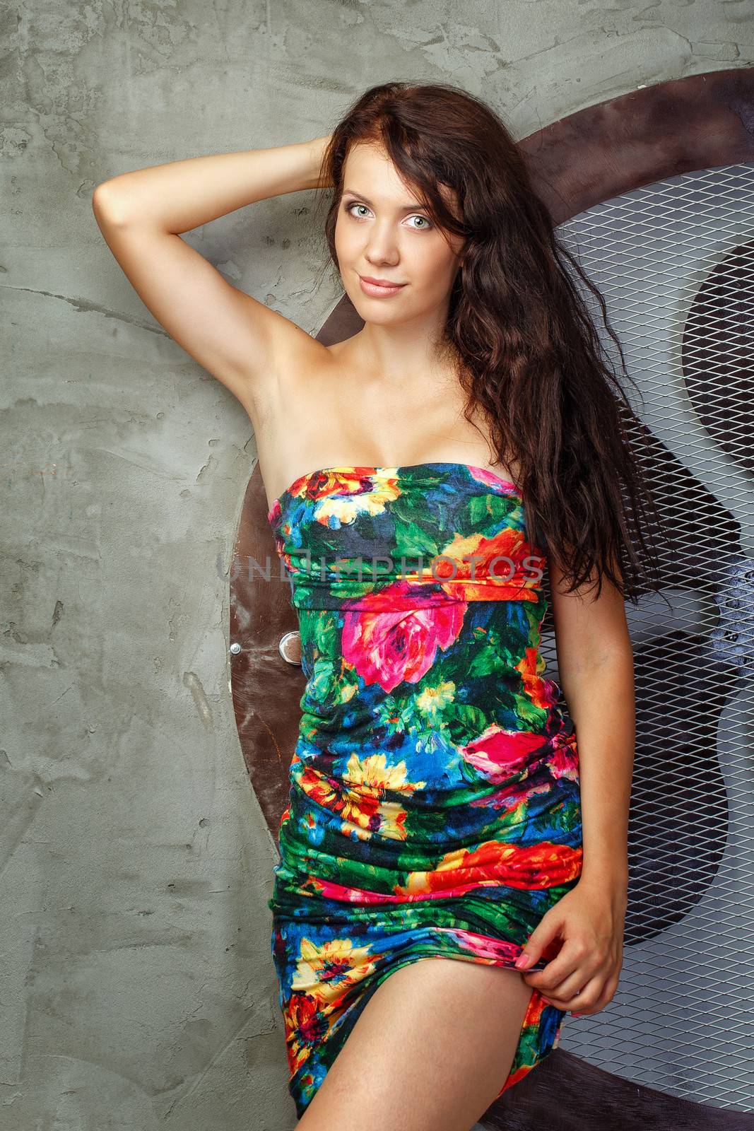 Beautiful young woman shot in studio on a background of interior