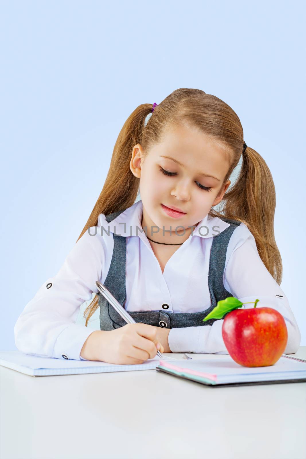 a little girl writing by mihalec