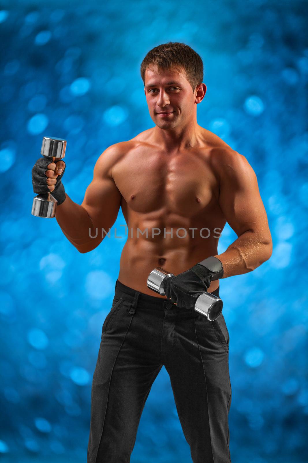 a muscular male with dumbbells