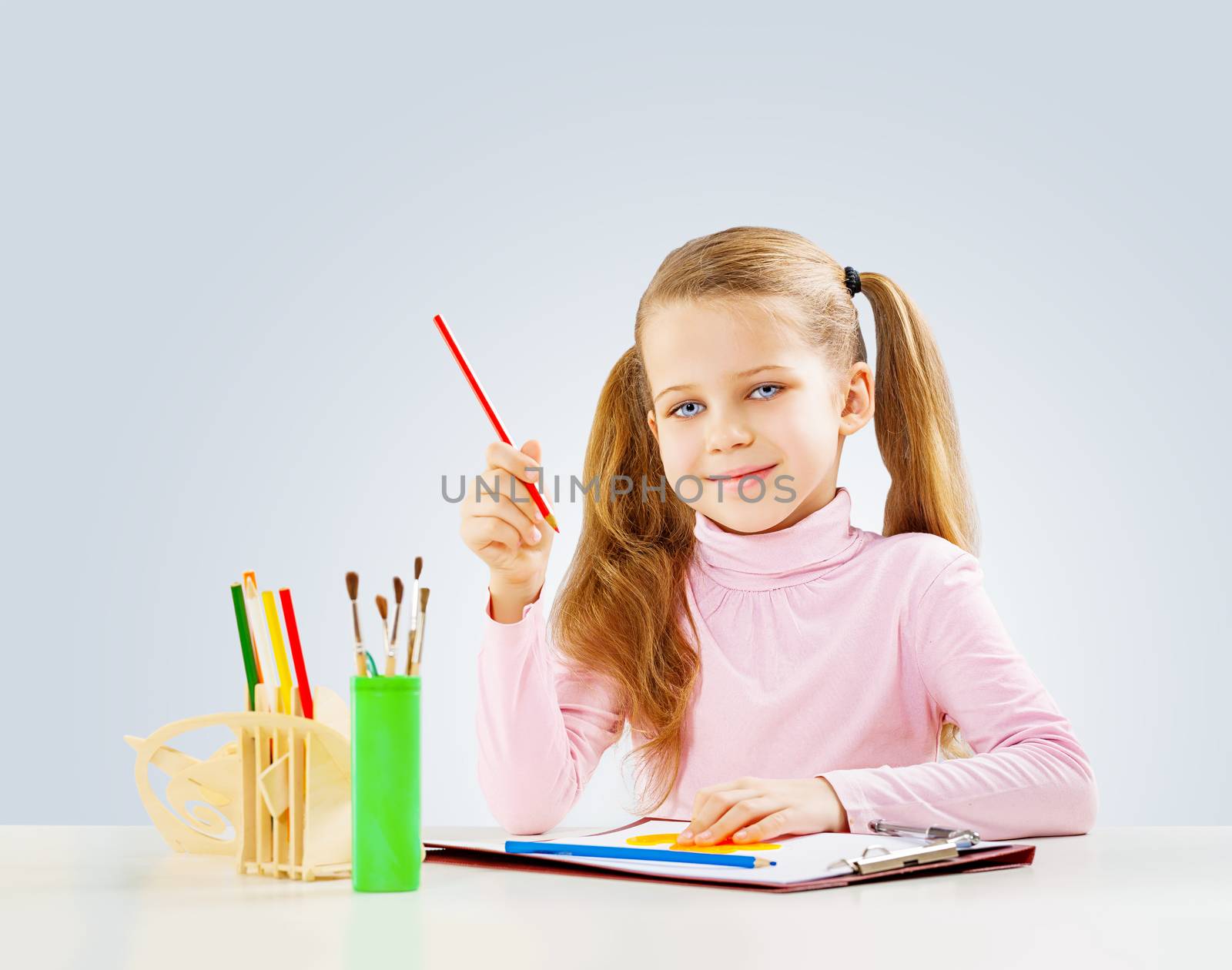 a shoolgirl at table do homework by mihalec