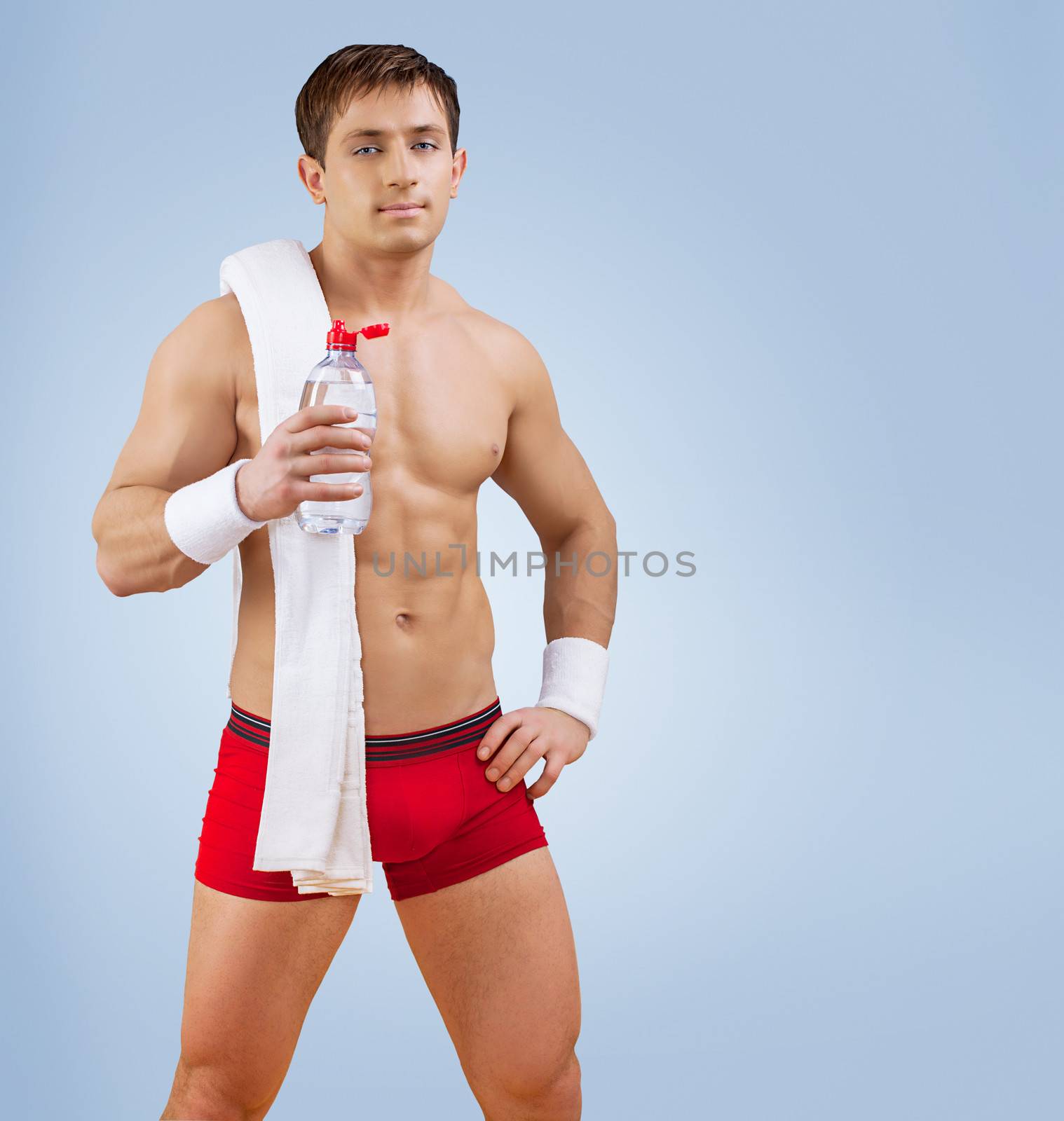 a handsome sportsman with bottle of water