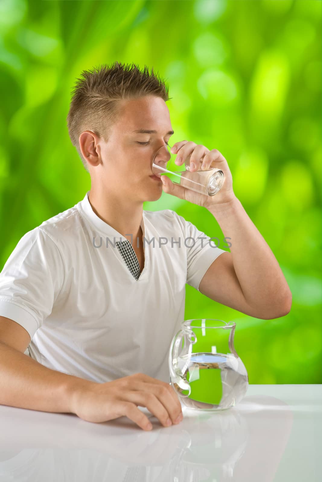 boy drinking water by mihalec