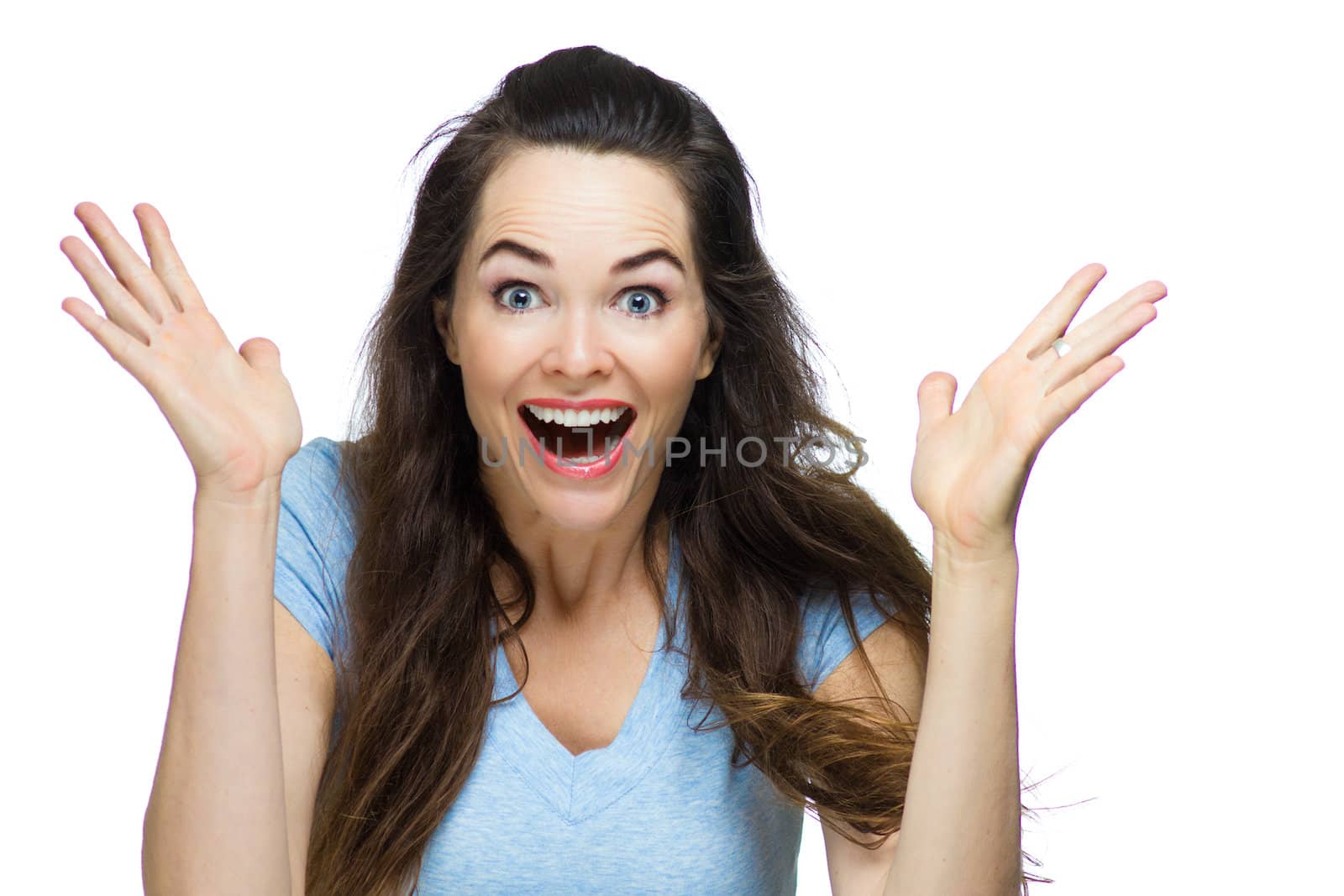 A very happy and surprised woman with her hands in the air. Isolated on white.