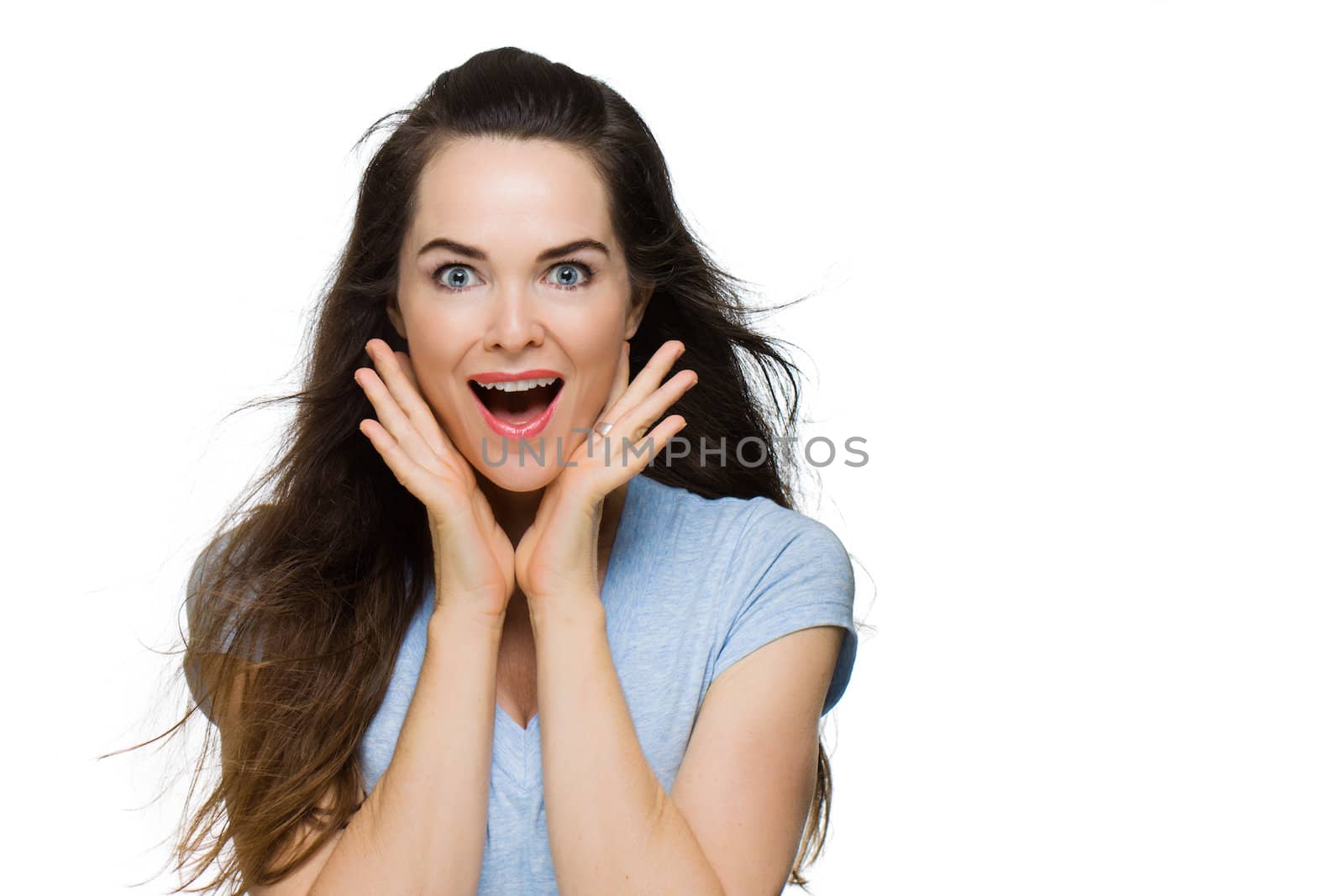 Happy surprised beautiful woman looking at camera. Isolated on white.